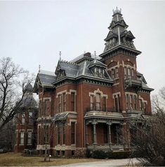 an old red brick building with many windows