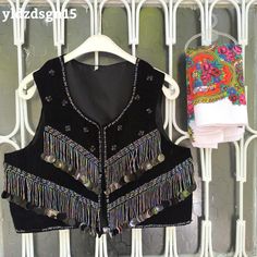 ❤️ Beautiful black vest with HANDMADE embroidery beaded flowers. This piece is truly a work of art! Our handmade vests are beautiful, stylish works of art combined with beads and sequins. The beads are charmingly arranged in colors that match perfectly with the carefully selected fabric. They are modern crop top style vests with a twist of indigenous and traditional textile from Mardin.  You can use it comfortably in your daily life or on special occasions. 💫 "Wearing it feels like getting a hu Bohemian Black Embroidered Vest, Black Folk Style Festival Vest, Embellished Bohemian Sleeveless Vest, Bohemian Fitted Vest For Party, Fitted Bohemian Vest For Party, Stylish Words, Handmade Vest, Embroidery Beaded, Navratri Dress