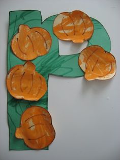 the letter f is made out of paper and has fish on it