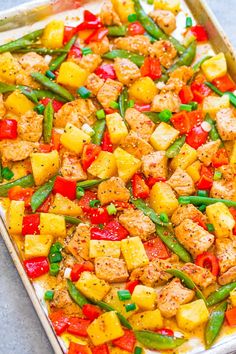 a casserole dish with chicken, peppers and green beans