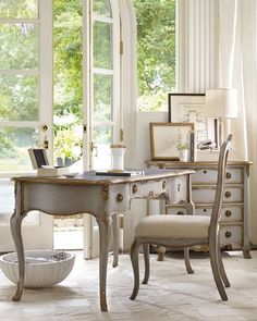 a white desk and chair in a room