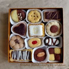 a box filled with lots of different types of cookies