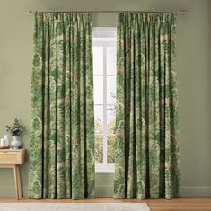 green curtains with trees on them in front of a window