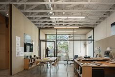 an empty room with tables and chairs in it