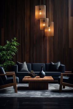 a living room with black couches and wooden wall paneling in the background, along with hanging lights