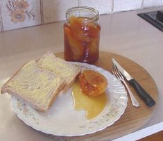 a white plate topped with toast and jam