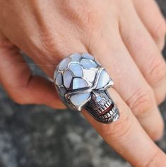 Handmade Exclusive Massive Skull Ring Pure 925 Sterling Silver with Natural Mother of pearl This beautiful Skull Ring has been Fabulously cast with .925 Sterling Silver and set with Hand Shaped Natural Mother of Pearl. The weight of this ring is 27 Grams The Ring size is 9 1/2 US. We will resize any size per your request. Please allow 2-3 weeks shipping as we are in Bangkok Thailand at this time We are a Los Angeles based company operating out of Thailand so that we may bring you the highest quality items at the most competitive prices. Just search and compare. We only offer authentic items. What we describe in our listings is 100% accurate and we encourage all of our customers to authenticate their purchases. USA please allow 14-21 business days Europe and U.K please allow 14-21 business Silver Skull Ring With Gemstone For Gift, White Sterling Silver Skull Jewelry, White Skull-shaped Sterling Silver Jewelry, Handmade White Gold Skull Ring Gift, Unique Silver Skull Ring Hallmarked, Handmade Skulls, Pearl Inlay, Skull Jewelry, Hand Shapes