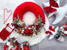 christmas wreaths and decorations are laid out on the floor