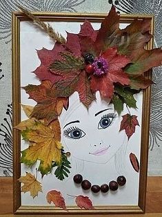 an image of a woman's face with leaves on her head and eyes in the frame