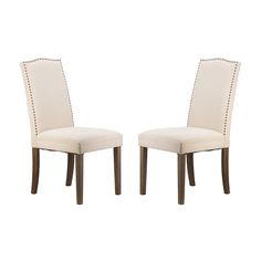 a pair of white chairs sitting next to each other