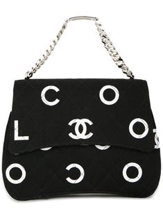 Black and white cotton logo print tote from Chanel Pre-Owned featuring a quilted effect, an all over logo print, a foldover top with snap closure, an internal zipped pocket and silver-tone chain top handle. Please note that pre-owned items are not new and therefore might have minor imperfections. Luxury White Bag With Logo Print, Designer Shoulder Bag With Logo Print, Black Top Handle Shoulder Bag With Embroidered Logo, Black Shoulder Bag With Top Handle And Embroidered Logo, Designer Black Bag With Logo Print, Black Cotton Shoulder Bag With Logo, Black Cotton Bags With Logo Print, Chain Top, Shopping Chanel