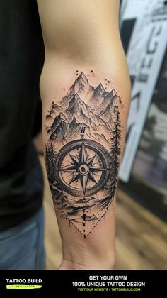 a man with a compass tattoo on his arm