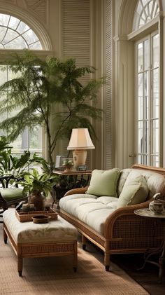 a living room filled with lots of furniture next to a large window covered in plants