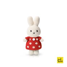 a crocheted white rabbit wearing a red dress