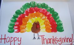 a handmade turkey card with the words happy thanksgiving written in red, green and orange