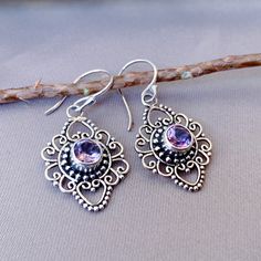 "The purple color to reddish-purple hues of amethyst has long been a symbol of peace, cleansing, and calming energy. The crystals represent purification and connection to spiritual and divine beings. The meaning of amethyst is attached to serenity, understanding, trust, and grace. Made by Balinese silver craftsmen with decades of skillful hands, it becomes a stunning piece of jewelry.  Personalize: if you have a personalize design, please contact me, I can make jewelry according to your design w Spiritual Gemstone Earrings For Anniversary, Purple Amethyst Jewelry Gift, Purple Round Spiritual Earrings, Spiritual Round Purple Earrings, Purple Amethyst Birthstone Earrings, Spiritual Purple Round Earrings, Spiritual Amethyst Jewelry Gift For Her, Elegant Purple Earrings As A Gift For Her, Spiritual Amethyst Jewelry As Gift For Her