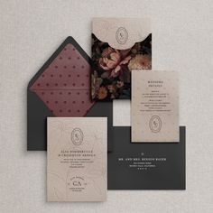 the wedding stationery is laid out on top of each other, with matching envelopes