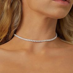 💎Elevate your style with our exquisite Diamond Tennis Necklace Choker, a dazzling accessory that effortlessly blends sophistication with a touch of coquettish charm 🌟 Features: - Available in both silver and gold to suit your unique style. - Crafted from high-quality 925 sterling silver and delicately plated with 18k gold for a luxurious finish. - Adorned with dainty zircon stones, each measuring 2mm for a subtle yet radiant sparkle. - Adjustable length with a convenient closure on the back, e Tennis Necklace Choker, Exquisite Luxury Silver Tennis Necklace, Minimalist Tennis Necklace For Anniversary, Dainty Rhinestone Necklace For Wedding, Minimalist White Tennis Necklace, Elegant Rhinestone Tennis Necklace For Anniversary, Elegant Tennis Necklace With Delicate Chain As Gift, Adjustable Diamond Necklaces With Sparkling Stones, Elegant Diamond White Necklaces With Rhinestones