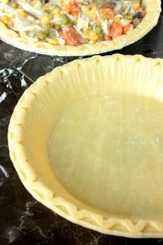 two pie pans sitting on top of a table