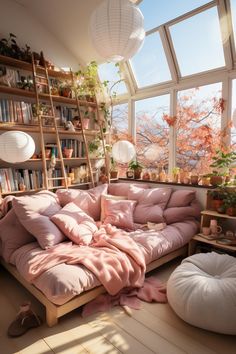 a living room filled with lots of furniture next to a large window covered in pink blankets