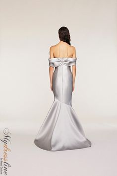 Looking for a show-stopping evening gown? Check out the Frascara 4231 Off-the-shoulder Gown. This gorgeous dress features a draped bodice and sleeve detail with an assymetrical bow. The mermaid silhouette is flattering and the hidden back zipper makes for easy on and off. Plus, the satin lining ensures a comfortable fit. 87% polyester, 13% silk.