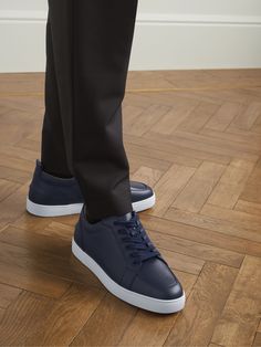 Christian Louboutin's take on minimal, clean-cut kicks, these 'Rantulow' sneakers will work just as well with jeans and a T-shirt as they will with relaxed tailoring. They're made from navy full-grain leather and branding-free, save for the shoemaker's signature debossed on the iconic red soles. Louboutin Sneakers, Christian Louboutin Shoes Sneakers, Louboutin Bags, Leather Sneakers Men, Red Sole, Latest Sneakers, Suede Sneakers, Black Sneakers, Lace Fashion