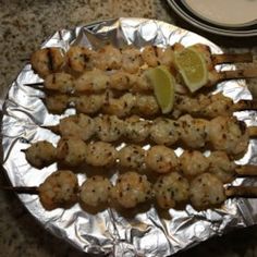 some food is sitting on top of tin foil and ready to be eaten by someone