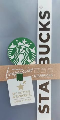 starbucks stickers are attached to the side of a sign