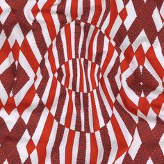 an abstract red and white pattern with circles in the center, as well as lines that appear to be moving