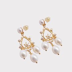 These earrings are parts of Valerie Chic’s new Maldives Escape Limited Edition Collection. Baroque pearls with irregular shape makes their unique charm and have been favoured by the queen and royal families for years. Baroque pearls represent elegance, sophistication, luck, success, and prosperity. These earrings are effortless chic and elegant that would match any outfit. They can be perfect bridal earrings, holiday earrings. Products include one pair of earrings. Please note that each pearl is unique that no two pieces are the same. Materials include 18k gold-plated brass, crystals, freshwater pearls. Our jewellery is handmade in Munich. Our jewellery can be taken care when you clean it with a microfiber cleaning cloth, avoid using chemicals or water, and do not leave the jewellery in ex Holiday Earrings, June Birthstone Jewelry, Baroque Pearl Earrings, Chic And Elegant, Forever Jewelry, Holiday Earring, Jewelry Ring Box, Pearl Jewellery Earrings, Chic Jewelry