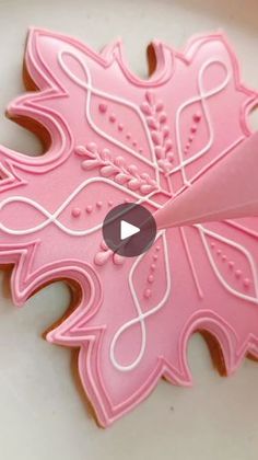 a video demonstrating how to make an intricately designed cookie with fondant icing