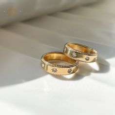 Gold Celestial Ring, Sun Rings, Water Proof Rings, 18K Gold Plated Jewelry, Celestial Simple Band, Gifts for Her, Celestial Jewelry, Gift. 💟 Material: Premium 316L Stainless Steel -18K Gold Plated. 💟 Gemstones: High-quality 3A Zircon Crystals 💟 Sizes: Available in US sizes 6, 7, 8 💟 Weight: Lightweight at just 3 grams 💟 Finish: Tarnish-free and hypoallergenic, ensuring long-lasting shine and comfort. 💫 Elegant Design: The classic gold finish paired with dazzling zircon crystals makes this ring a standout accessory. 💫 Durability: Made from high-quality stainless steel, it resists tarnishing and maintains its luster. 💫 Comfortable Fit: Lightweight and hypoallergenic, suitable for sensitive skin. 💫 Versatile: Perfect for everyday wear, whether at work, the gym, or a night out. Gold Open Ring Diamond Couple Rings, Gold Open Diamond Couple Rings, Celestial Style Gold Round Rings, Fine Gold Jewelry For Wedding With Bezel Setting, Promise Jewelry With Diamond Accents In Celestial Style, Gold Jewelry With Halo Design For Gifts, Gold Halo Jewelry As A Gift, Dainty Gold Jewelry With Halo Design, Dainty Gold Jewelry With Halo