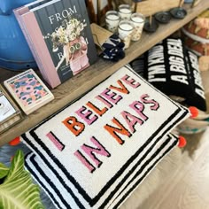 a table topped with books and pillows on top of it