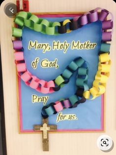 Preschool Rosary Craft, Rosary Projects For Kids, Lent Bulletin Boards Catholic, Lent Door Decorations Classroom, Mary Bulletin Board Ideas, Rosary Bulletin Board Ideas, Catholic Schools Week Art Projects, Rosary Crafts For Kids Catholic, Catholic Schools Week Ideas Activities