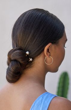 Add a touch of timeless elegance to your hairstyle with the L. Erickson Mini Daphne Chignon hair pin. Crafted with two sturdy prongs, this exquisite accessory is specially designed to secure even the thickest of hair types with ease. Its lustrous gold finish and faux pearl embellishment create a sophisticated look that's perfect for any occasion.With its shiny and smooth metal construction, the Mini Daphne Chignon hair pin not only offers durability but also ensures a secure and comfortable hold Elaborate Updo, Simple Chignon, Hair Accessories Ponytail, Low Chignon, Pearl Embellishment, Chignon Hair, Low Bun Hairstyles, Gold Hair Pin, Crystal Hair Pins