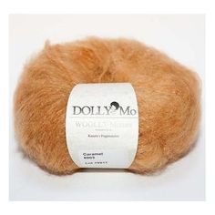 a ball of wool yarn with the label dolly mo written on it in white and orange