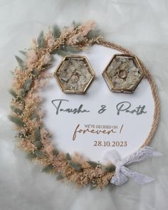 the wedding earrings are decorated with dried flowers and greenery for an elegant touch to the couple's special day