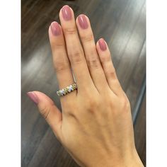 a woman's hand with a ring on it