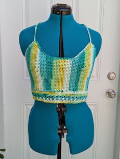 Extra large handmade crochet top with lace-up back in shades of green & yellow. 100% cotton. Sizing (Bust Measurement): XS = 28-30" S = 32-34" M = 36-38" L = 40-42" XL = 44-46" XXL = 48-50" For best care, hand wash or machine wash in delicates bag on a gentle cycle and lay flat to dry. Made from Sneak A Peek pattern (with modifications) by Kelsie at PassioKnit Goods, passioknitgoods.com. Green Cotton Crop Top For Spring, Green Sleeveless Crochet Top With Crochet Trim, Green Cotton Crochet Top With Crochet Trim, Fitted Green Crochet Top For Spring, Fitted Yellow Crochet Lace Top, Fitted Yellow Cotton Crochet Top, Green Cotton Festival Crop Top, Festival Green Cotton Crop Top, Fitted Green Top For Festival