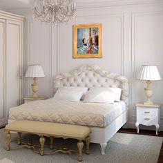 a bedroom with white furniture and chandelier hanging from the ceiling, along with a large bed that has an upholstered headboard