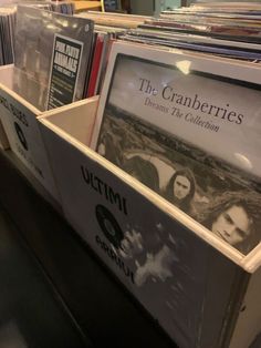 the cranberries albums are stacked on top of each other in a record store