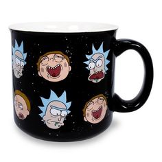 a black coffee mug with the faces of cartoon characters printed on it and stars in the background