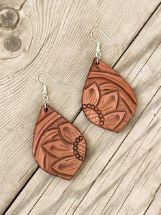 Earrings are lightweight and hand tooled from scratch. Finished product may vary slightly from the picture due to its handmade nature. Earrings are finished with silver earring hooks for easy wearing. Brown Hand Tooled Drop Earrings, Hand Tooled Teardrop Earrings For Gift, Unique Hand-tooled Teardrop Earrings, Artisan Hand-tooled Earrings For Gift, Artisan Hand-tooled Teardrop Earrings, Hand Tooled Adjustable Dangle Earrings, Country Earrings, Tooled Leather Earrings, Sunflower Accessories