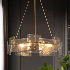 Designed to give a fresh appreciation of classic decor, the modern gold 6-light chandelier features a greatly proportioned art glass shade that encircles the vintage-style candelabra lighting sources. The polished brass elements have a modern purity, while the textured glass shade diffuses light in different ways according to the using spaces, showing high compatibility with heirloom decor. This contemporary glass drum chandelier is a balance of classic style and modern trend. Perfect choice for Gold Drum Chandelier, Modern Chandelier Dining, Modern Kitchen Pendants, Drum Light, Glass Floats, Foyer Lighting, Contemporary Chandelier, Drum Chandelier, Gold Chandelier