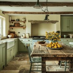 a wooden table topped with lots of yellow fruit sitting next to a stove top oven