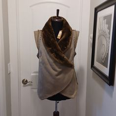 Faux Suede/Fur Vest With Snap Closure. 100% Polyester. Stud Detail Around Arm. 23" Long. Pale Green/Gray Color. Fitted Winter Outerwear With Faux Front Pockets, Fitted Faux Wrap Winter Outerwear, Wrap Vest, Faux Fur Wrap, Fur Wrap, True Grit, Fur Vest, Pale Green, Snap Closure