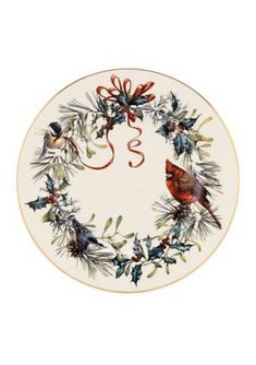 a christmas wreath plate with two birds on it