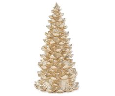 a gold christmas tree with seashells and shells on the bottom, against a white background