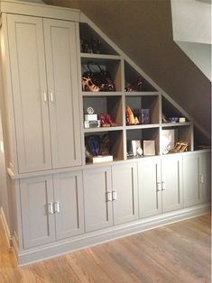 an attic bedroom with built - in storage units