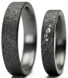 two wedding bands with diamonds on them are shown in black and white gold plated